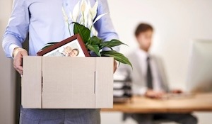 Image of an employee leaving work with a box
