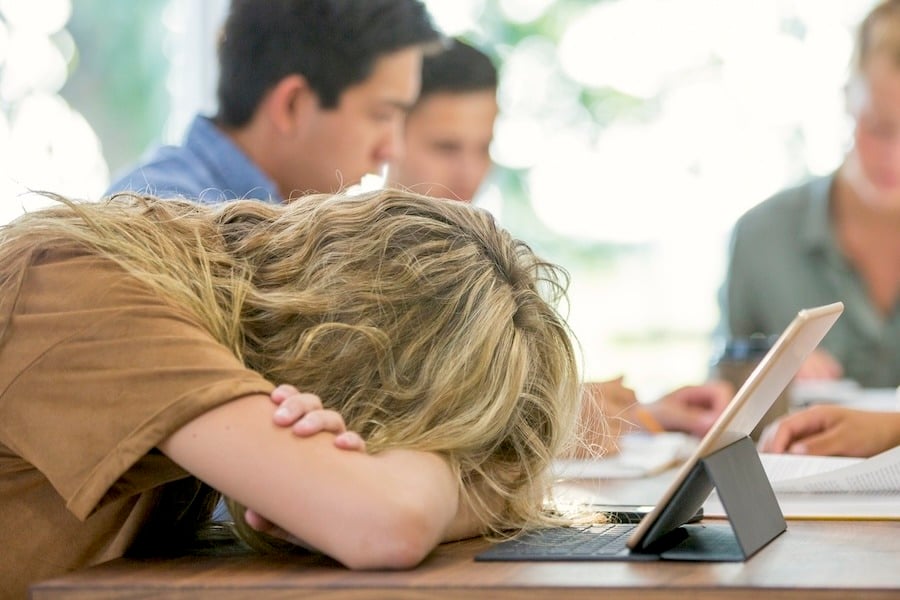 tired employee at desk