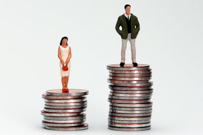 Image of man and woman on top of coins