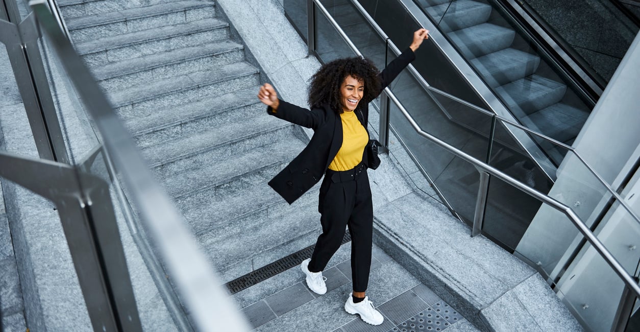 happy employee walking down stairs