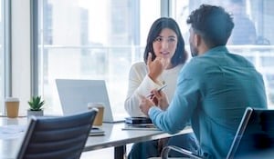 manager and employee discuss pay