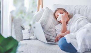 Image of a sick person in bed