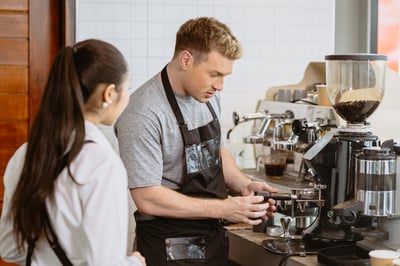 Man making coffee as a work test